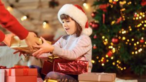 child receiving a holiday gift